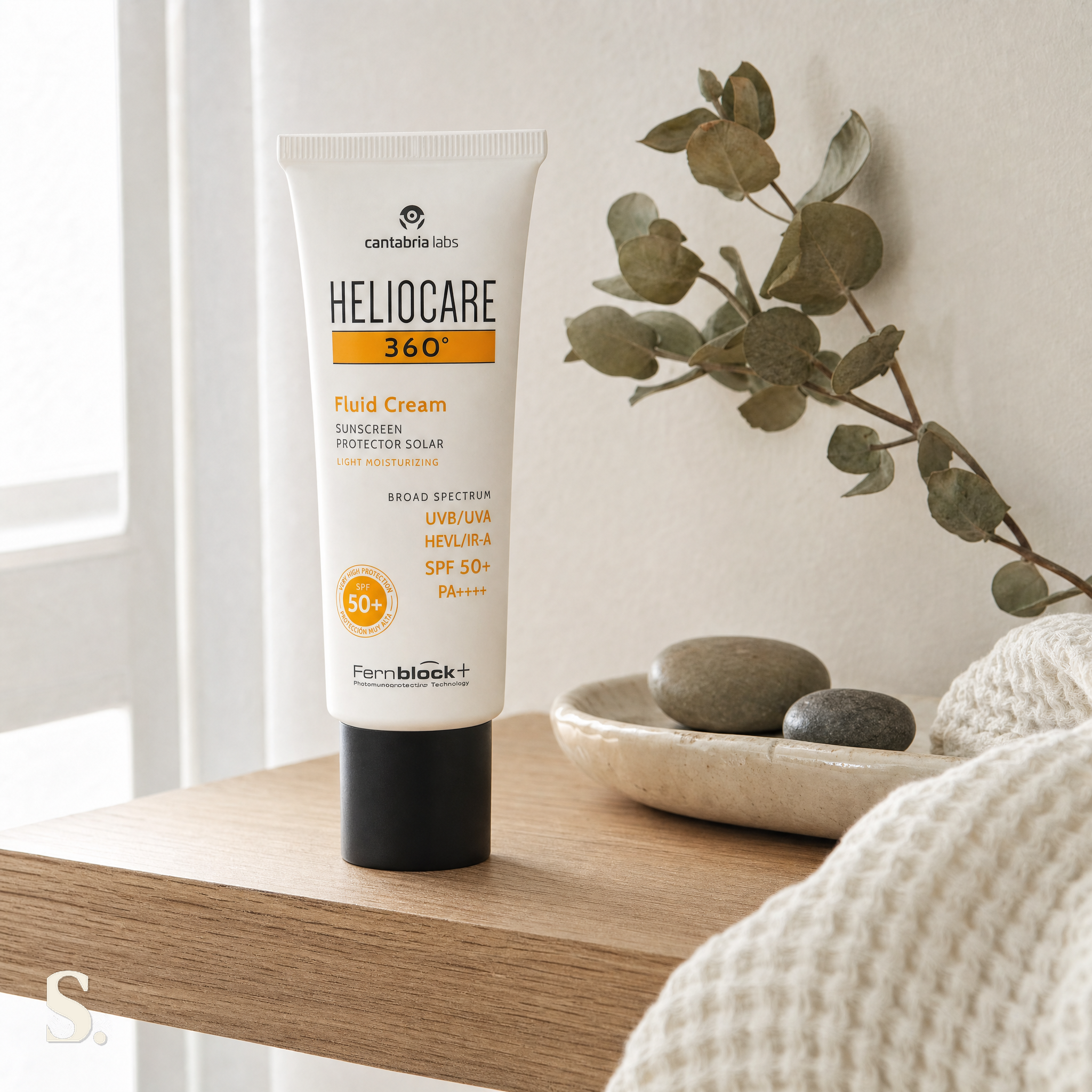 Heliocare 360° Fluid Cream SPF50+ in a lifestyle bathroom setting — Skintique review