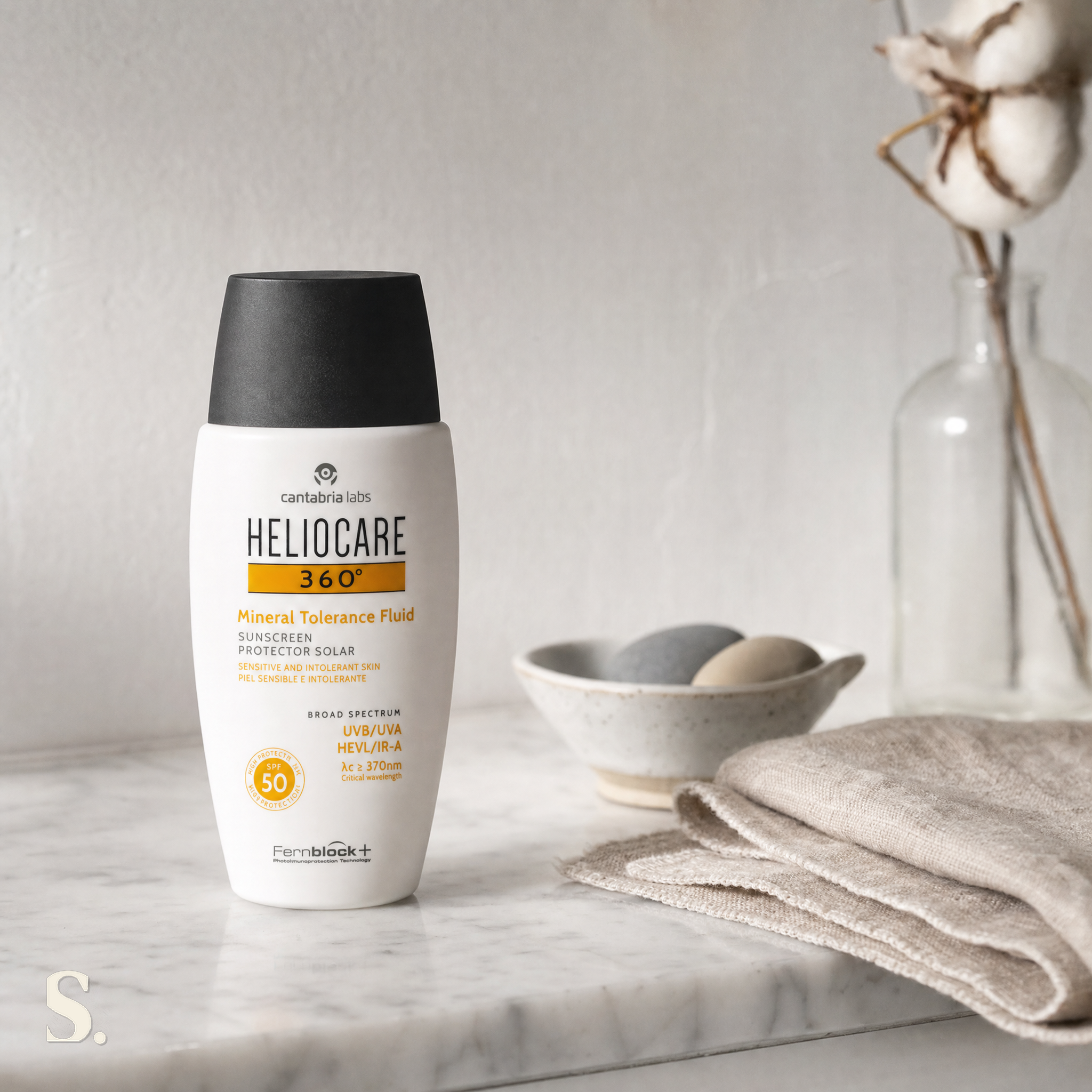 Heliocare Mineral Tolerance Fluid SPF50 in a lifestyle bathroom setting — Skintique review