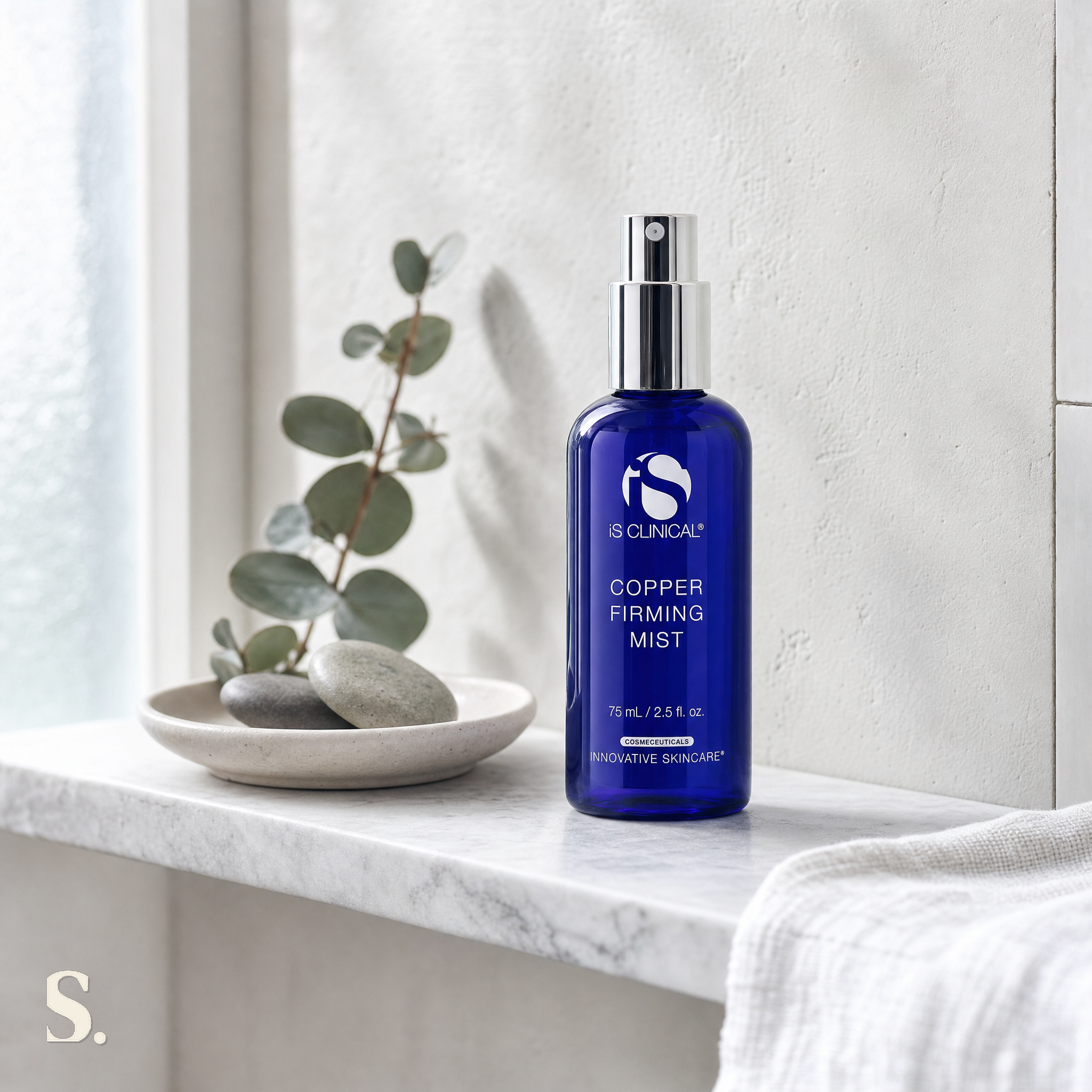iS Clinical Copper Firming Mist in a lifestyle bathroom setting — Skintique review