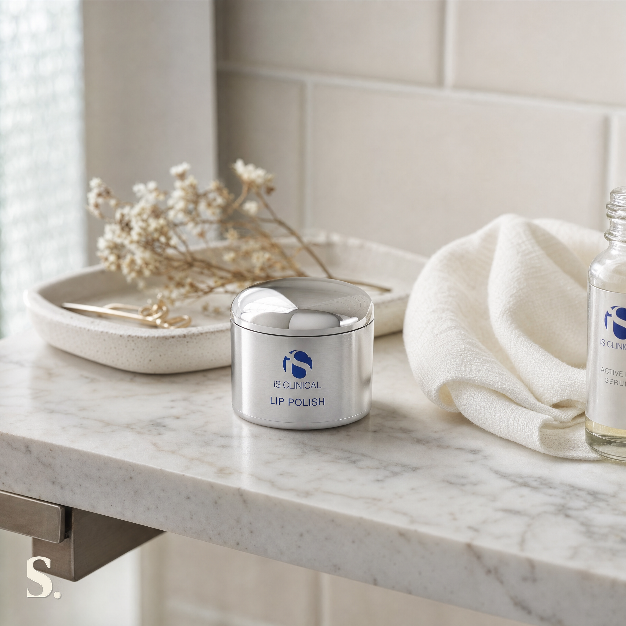 iS Clinical Lip Polish in a lifestyle bathroom setting — Skintique review