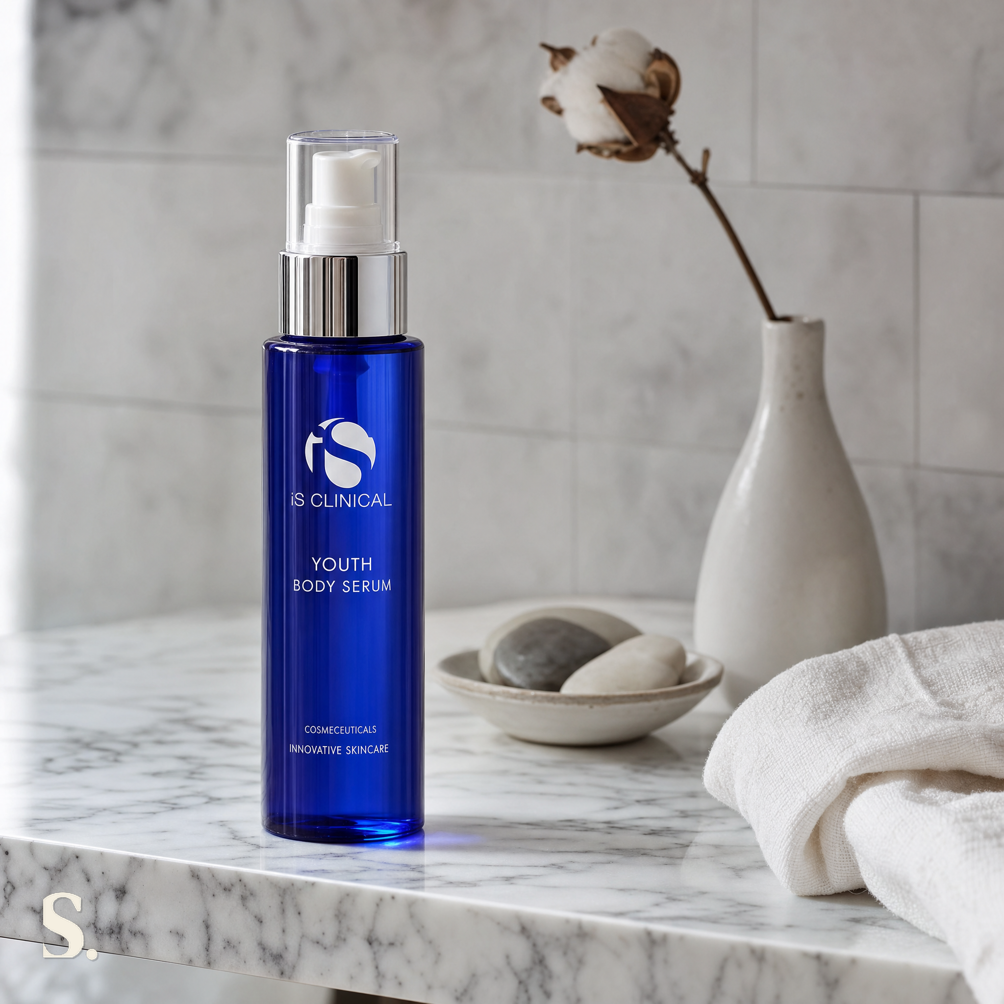 iS Clinical Youth Body Serum in a lifestyle bathroom setting — Skintique review