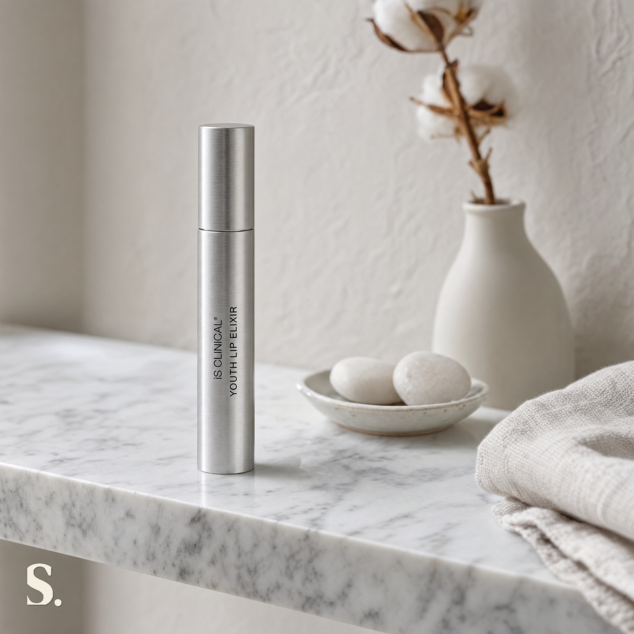 iS Clinical Youth Lip Elixir in a lifestyle bathroom setting — Skintique review