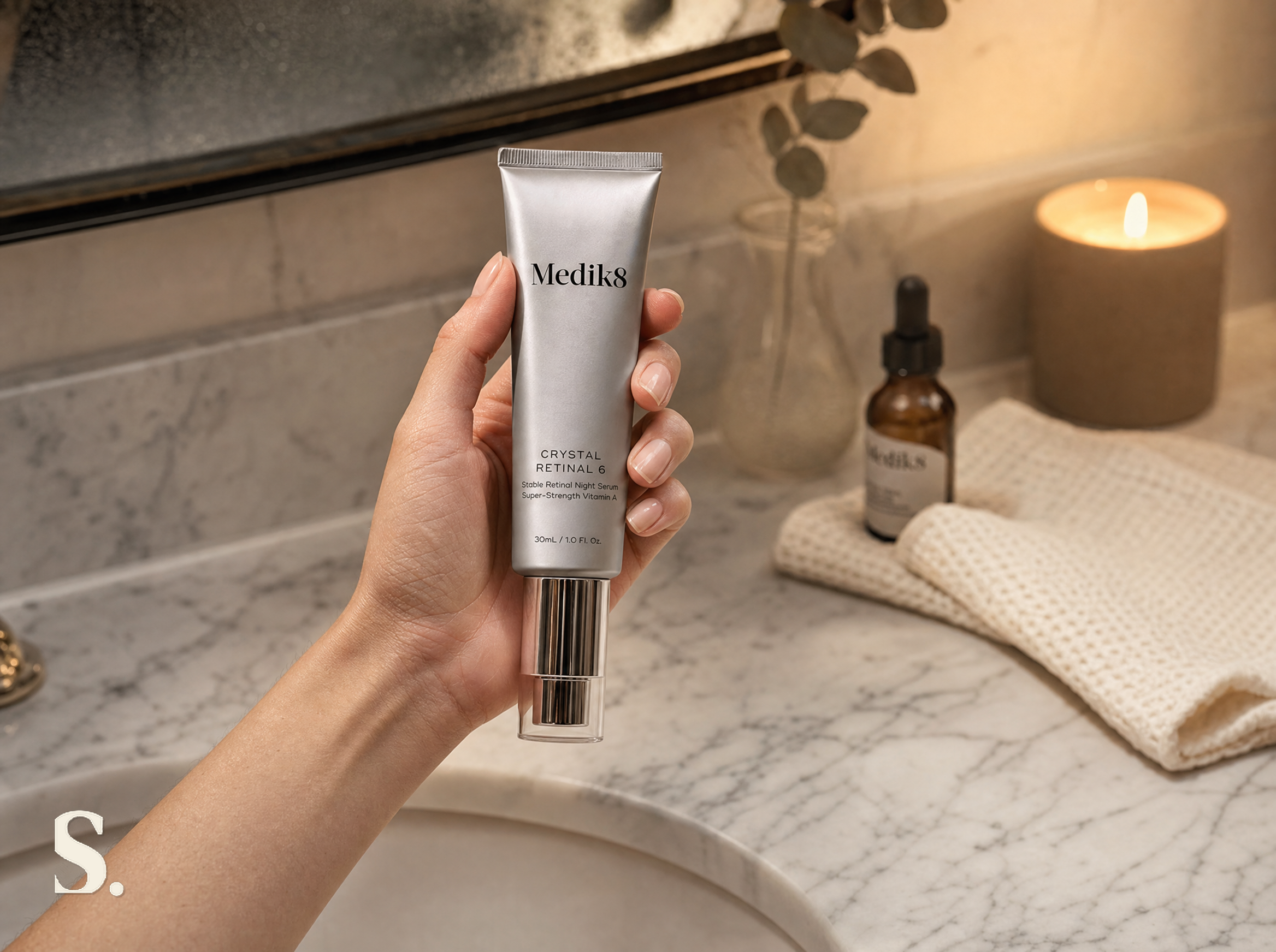 Applying Medik8 Crystal Retinal night serum during an evening skincare routine — Skintique review