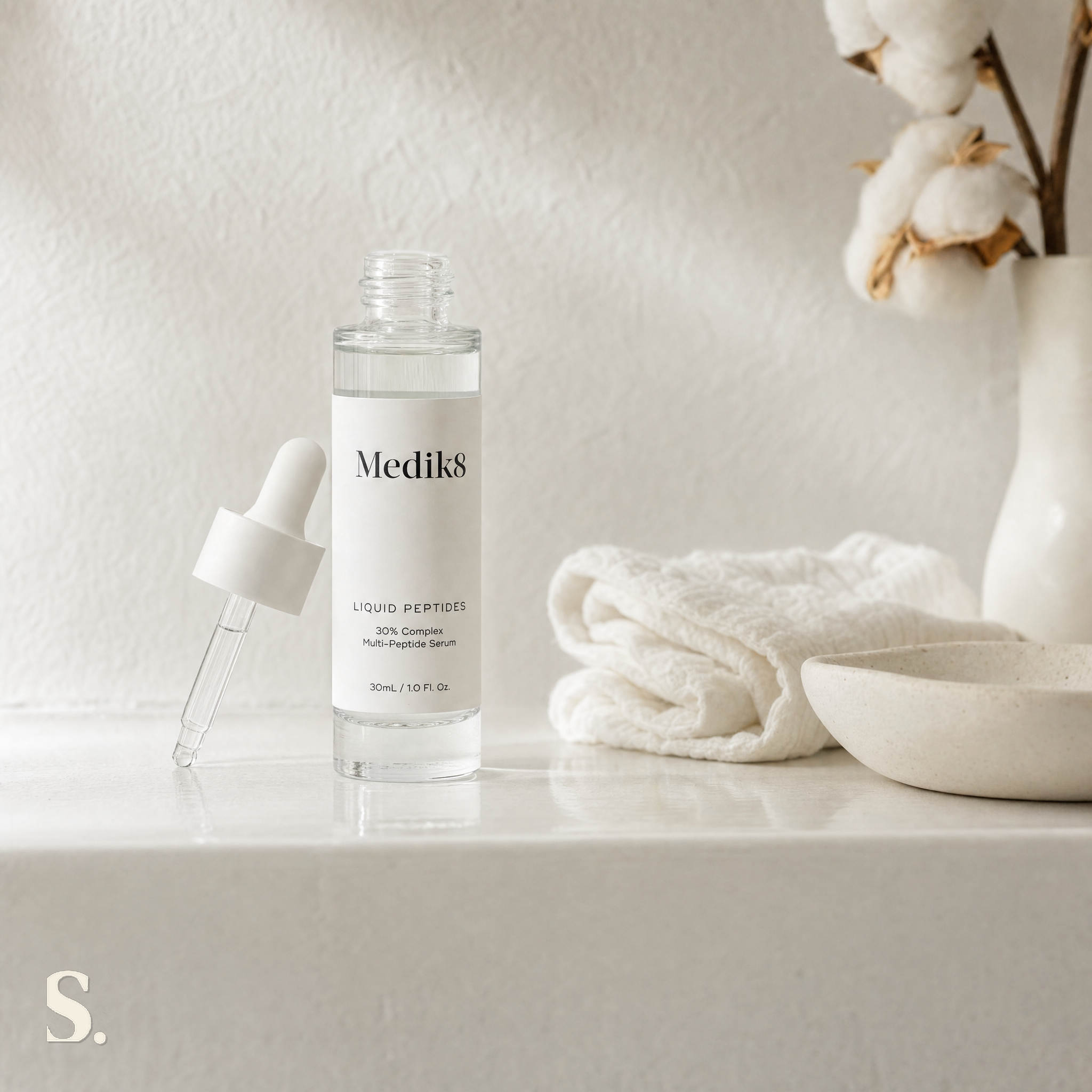 Medik8 Liquid Peptides in a lifestyle bathroom setting — Skintique review