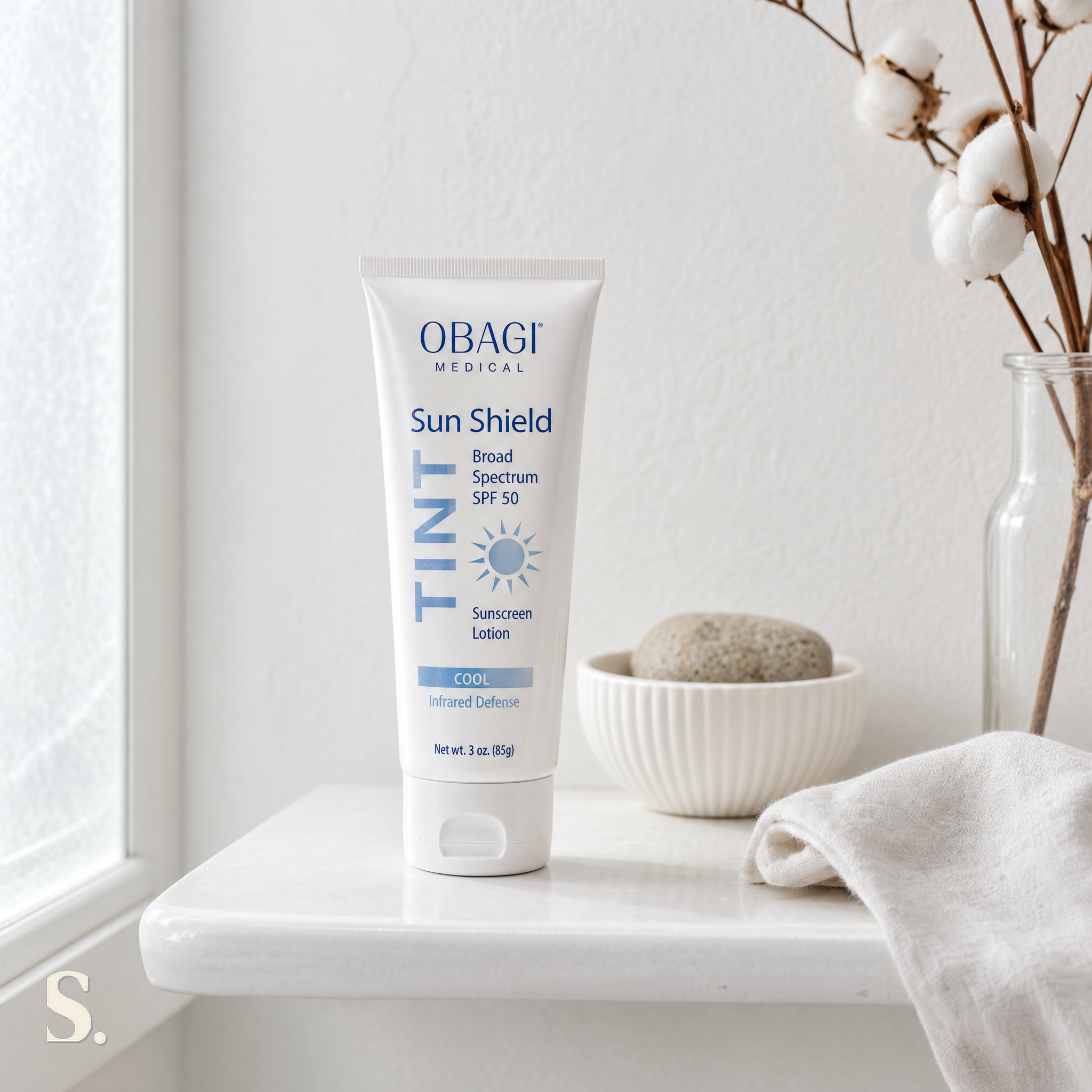 Obagi Sun Shield Tint Cool SPF50 in a lifestyle bathroom setting — Skintique review