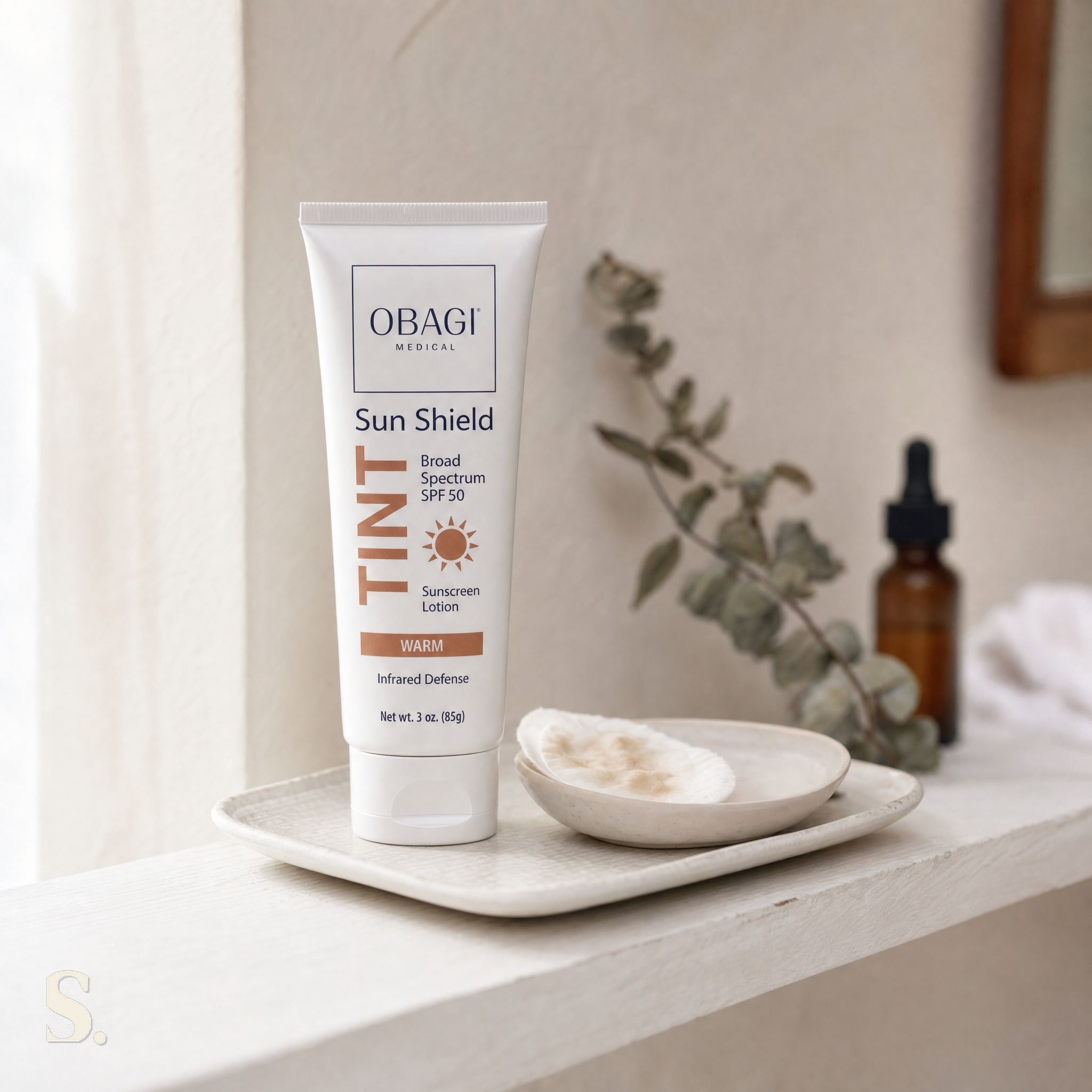 Obagi Sun Shield Tint Warm SPF50 in a lifestyle bathroom setting — Skintique review
