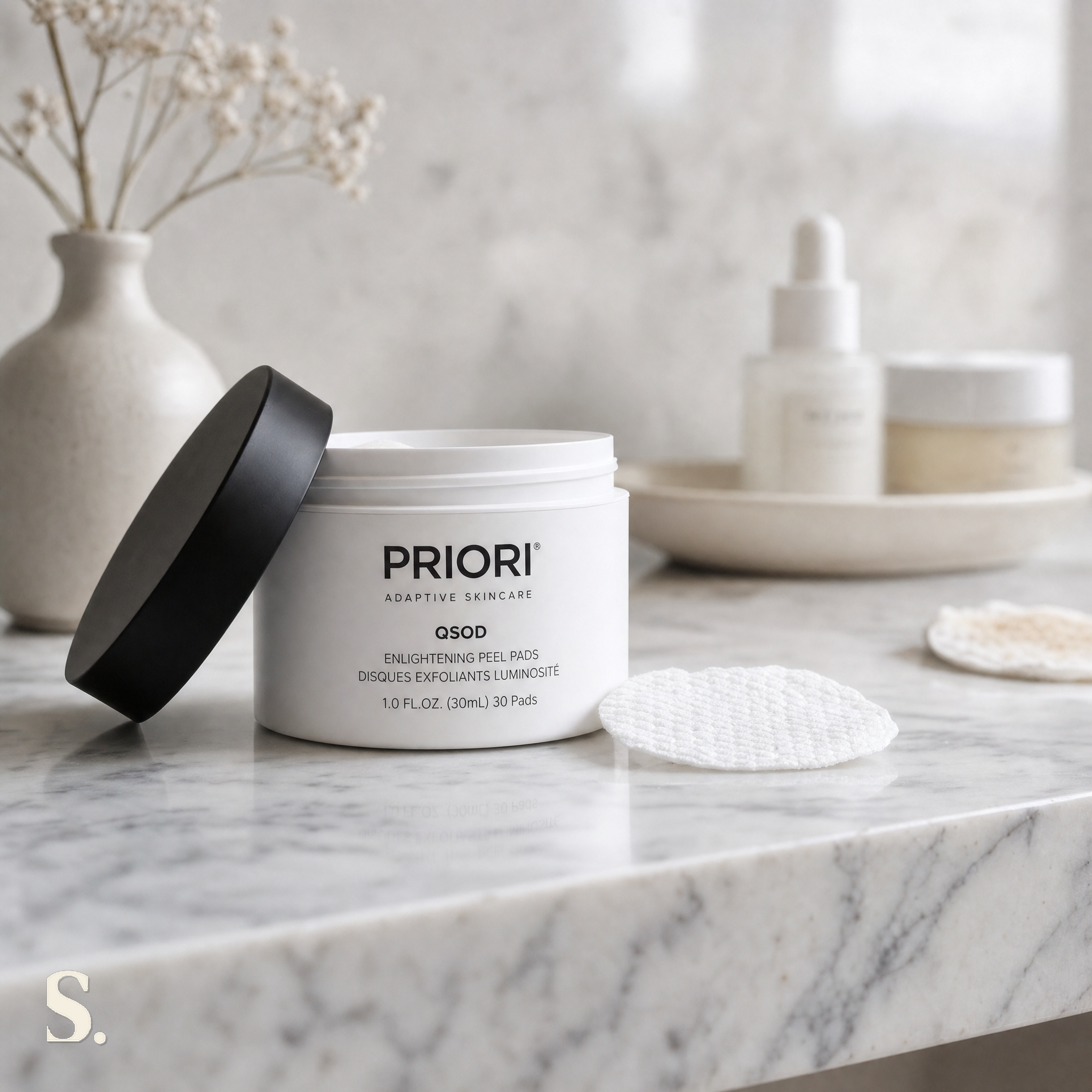 Priori Q+SOD Enlightening Peel Pads in a lifestyle bathroom setting — Skintique review